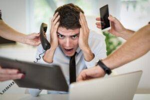 Overworked Businessman - image phone-interruptions-300x201 on http://cavemaninasuit.com