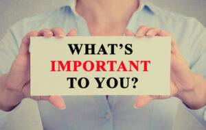 Businesswoman hands holding sign What is important to you - image Whats-important-300x190 on http://cavemaninasuit.com
